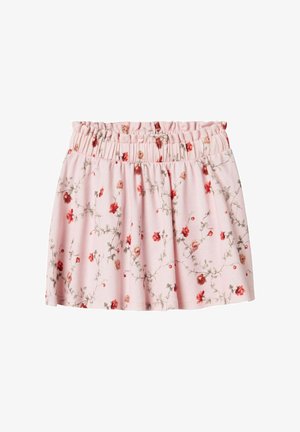 Jupe florale rose avec une taille élastique, présentant un motif de fleurs rouges et beiges sur un tissu doux et léger.