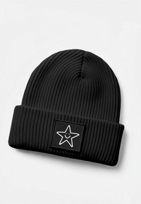 Black ribbed beanie made of knitted fabric, featuring a rectangular patch with a smiling star graphic in white.
