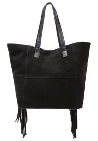 Black suede tote bag with leather handles, featuring side fringes and a flat, structured design. Accents provide a textured look.