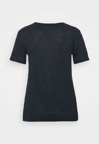 Plain black short-sleeve T-shirt shown from the back on a neutral light gray background.