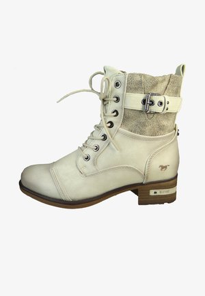 Cream-colored leather ankle boot with laces, textured tan suede cuff, silver accents, and wooden block heel. Features logo on side.