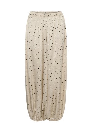 Pantaloni largi bej cu buline negre, talie elastică și manșete elastice strânse la glezne.