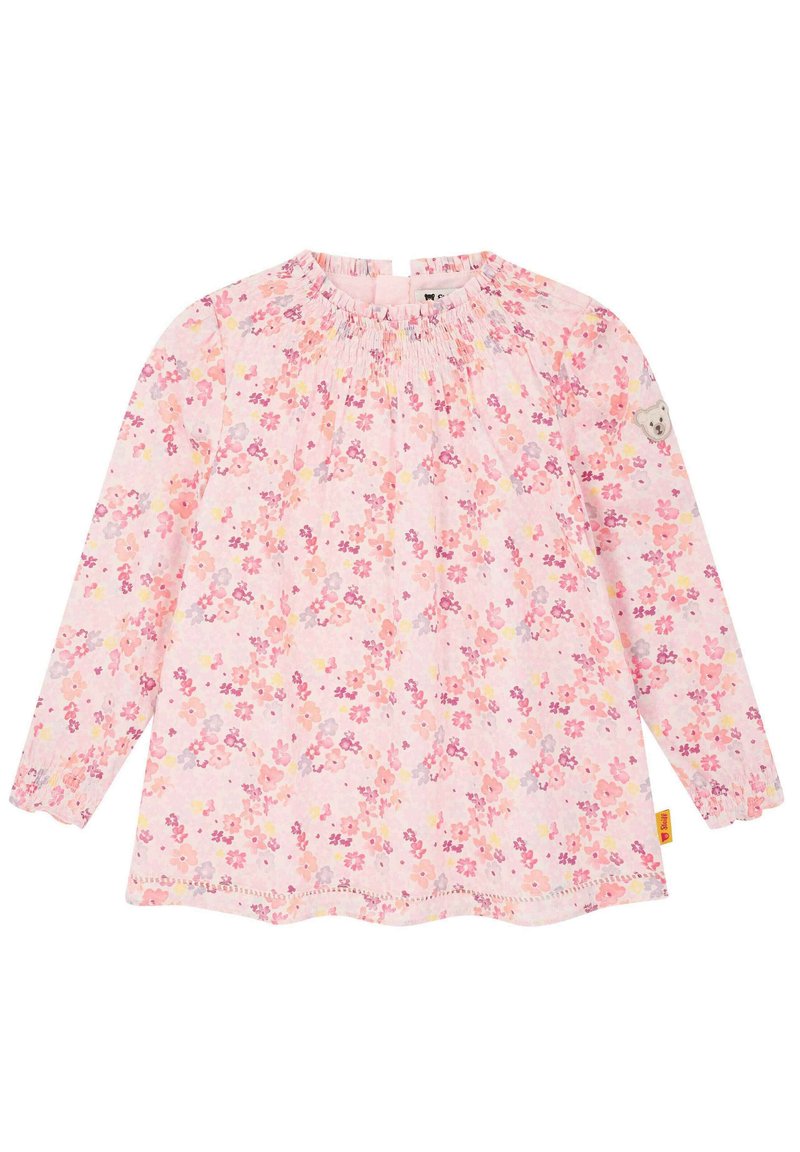 Blusa a maniche lunghe rosa con motivi floreali in tonalità di rosa, giallo e lilla. Presenta un colletto arricciato e polsini elasticizzati.