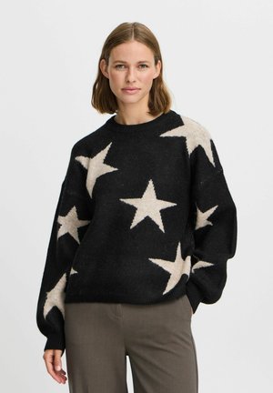 Black sweater made of knit fabric with large cream stars, a crew neck, and a relaxed fit. Ribbed cuffs and hem with a textured finish.