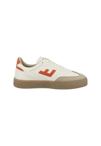White sneakers with orange accents, textured rubber sole, and a logo on the side. Features lace closure and a smooth leather finish.