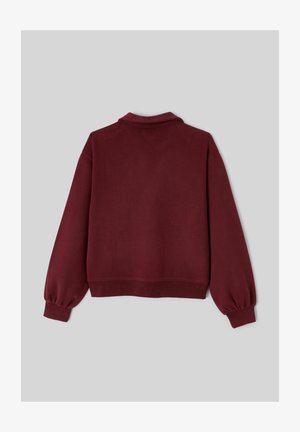 Sweat-shirt bordeaux à coupe décontractée, avec des poignets côtelés et un col classique. Fabriqué en tissu doux et texturé, avec une couleur unie.