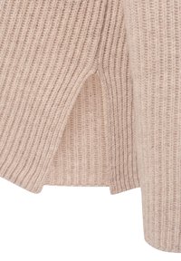 Helle beige, gerippte Strickpullover-Qualität mit seitlichen Schlitzen. Verfügt über ein strukturiertes, vertikales Muster und eine weiche, gemütliche Optik.