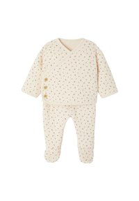 Baumwoll-Babyoutfit in Creme mit einem Wickeldesign, übersät mit kleinen roten Blumen. Verfügt über zwei Holzknöpfe auf der Vorderseite und Fußhosen.