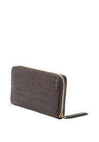 Brown crocodile-embossed leather wallet with a gold zipper, rectangular shape, and a wrist strap for easy carrying.