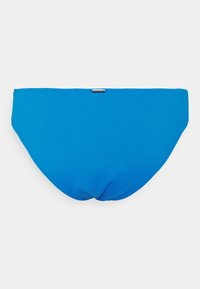 Parte de baixo de biquíni azul feita de tecido canelado. Apresenta um design sem costura e uma pequena etiqueta de logo na parte de trás.