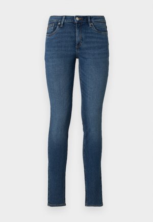 Tynne blå jeans laget av denim med midjehøyde, fem lommer og en falmet vask, med vanlig søm og glidelås i front.