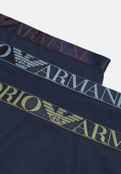 Dark blue cotton boxer briefs with three elastic waistbands in burgundy, light blue, and olive green featuring logo designs.