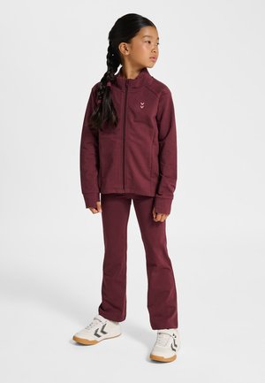 Maroon zip-up jacket and matching pants in soft fabric. Features a subtle logo on the chest, long sleeves, and fitted silhouette.