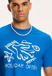 Shiwi Triko s potiskem - skydive blue