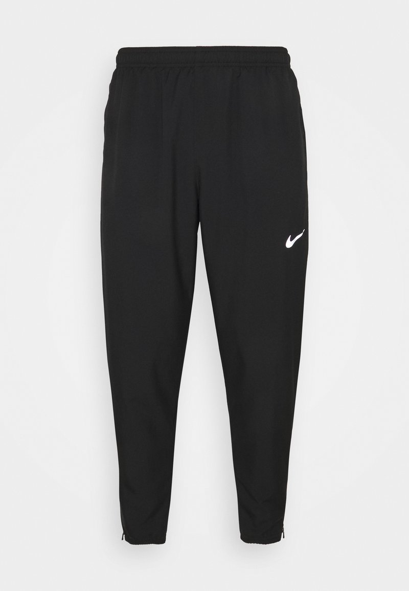 Pantaloni tuta neri Nike con vita elastica, gambe affusolate, cerniere alle caviglie e logo bianco sulla coscia sinistra. Tessuto liscio e leggero.