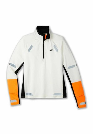 White long-sleeve athletic top with a black collar, orange accents on sleeves, and reflective gray details. Zippered front design.