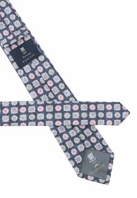 Blue fabric bow tie with circular floral patterns in pink, white, and blue. Features a gray label with a top hat logo and "be gentle."