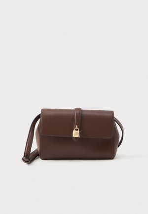 Brown leather crossbody bag with flap closure secured by a gold-colored lock and an adjustable shoulder strap.
