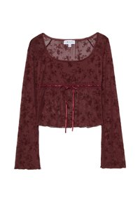 Blusa bordeaux a maniche lunghe in tessuto trasparente con motivi floreali, corpetto aderente e dettaglio a fiocco in vita.