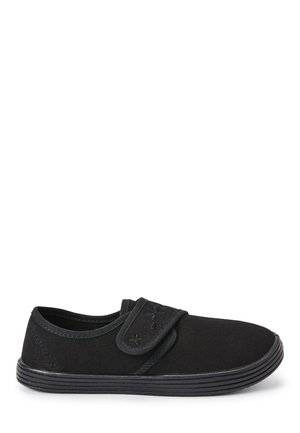 Melns kanvas slip-on apavi ar āķa un cilpas siksniņu, ar noapaļotu purngali un teksturētu gumijas zoli. Vienkāršs dizains vieglai valkāšanai.