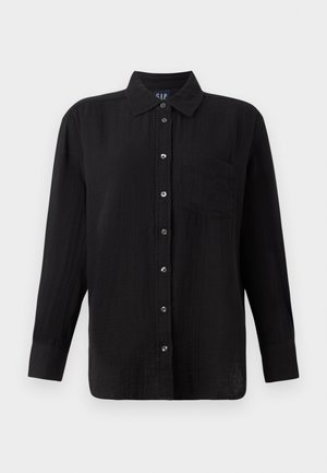 Black button-up shirt with long sleeves, a collar, and a chest pocket. Made of textured fabric with silver-tone buttons.
