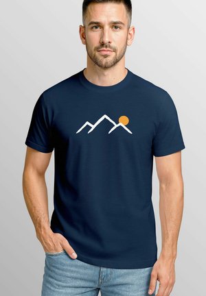 Navy blue cotton t-shirt featuring a white mountain outline design and an orange sun graphic on the front. Short sleeves, crew neck.