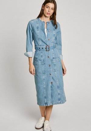 Denim dress with long sleeves, button front, and two front pockets. Light blue color, belted waist, and a midi length. Textured fabric.