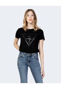 Musta lühike T-särk, millel on läikivast mustast värvist kolmnurkne graafika ja tekst "GUESS U.S.A. WASHED JEANS" koos küsimärgi symbolem.