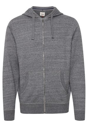 Sivi zip-stil dukserica izrađena od mekog materijala, s kapuljačom, dva prednja džepa i rebrastim manžetama i donjim delom. Jednostavan, teksturiran dizajn.