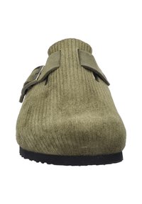 Olive green slip-on shoe with ribbed texture, two adjustable buckles, and a flat black rubber sole. Minimalist design with no visible branding.