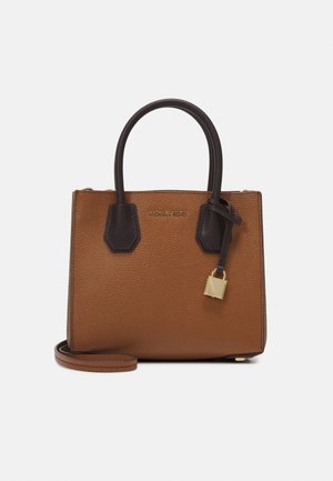 Brown leather handbag with dark brown handles, gold lock charm, and a detachable shoulder strap against a plain background.