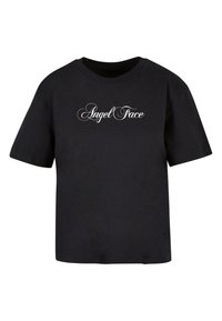 Svart bomull T-skjorte med korte ermer og rund hals. "Angel Face" er trykt med hvit skrift foran.