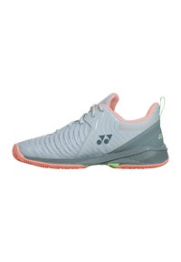 Light gray sports shoe with mesh upper, pink accents, textured design, and rubber sole featuring green and pink details.