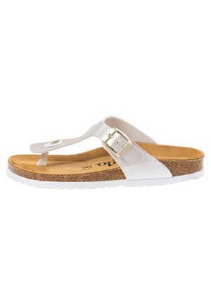 White thong sandal with a cork footbed and white rubber sole. Features a metallic buckle and a smooth leather strap with circular accents.
