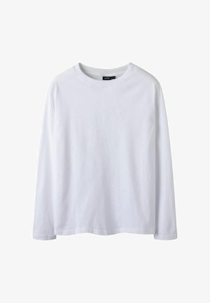 Maglietta bianca a maniche lunghe in cotone. Presenta un collo rotondo, un taglio dritto e una leggera curvatura nell'orlo per una vestibilità rilassata.