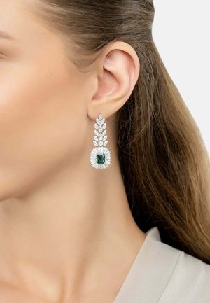 Emerald-cut green gemstone earrings with a silver leaf design, featuring clear gemstone accents and a textured finish.