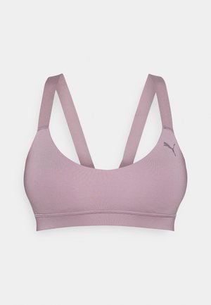 Ljuslavendel sportbh med breda axelband och en mjuk yta. Har en diskret logotyp och en enkel, minimalistisk design. Ingen vaddering.