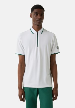 White polo shirt with a zippered collar, featuring green accents on the collar and sleeves. Smooth fabric, regular fit, and logo detail on sleeve.
