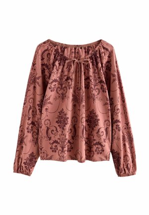 Langarmshirt in mattem Rosé mit dunklem floralen Damastmuster. Verfügt über einen gerafften Ausschnitt mit Bindeband und elastischen Bündchen.