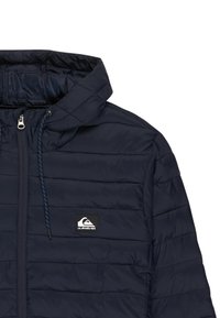 Navy blue quilted jacket with hood, front zipper, drawstring cords, and a small rectangular logo patch on the left chest.