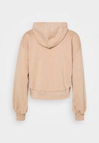 Hoodie beige cropped con maniche lunghe e polsini e vita a costine, mostrato da dietro su uno sfondo neutro.