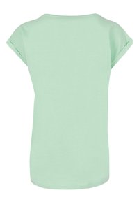 Minzgrünes Kurzarm-T-Shirt mit rundem Halsausschnitt, lockerer Passform und umgeschlagenen Ärmeln. Weicher Stoff mit glatter Textur.