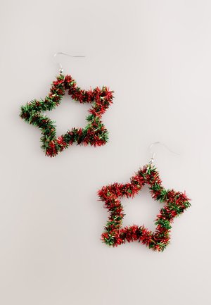 Star-shaped earrings made of red and green tinsel with a metallic hook. Textured surface with a shiny finish. Lightweight design.