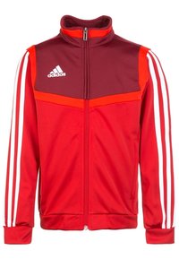 Rode Adidas trainingsjacket met een kastanjebruin bovenpaneel, witte strepen langs de mouwen, een staande kraag en een ritssluiting aan de voorkant.