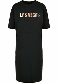 Svart T-skjortedress med rund hals, korte ermer og et grafisk trykk med teksten "LAS VEGAS" i fargerike bokstaver over brystet.