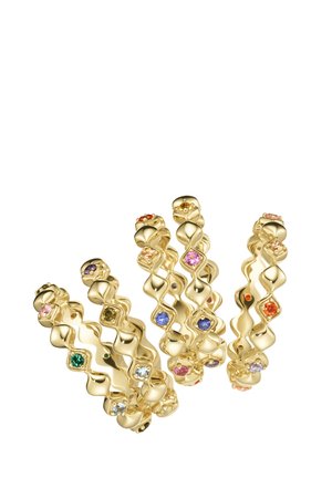 Five gold rings with wavy bands, each set with multiple small colorful gemstones in various shapes and colors.