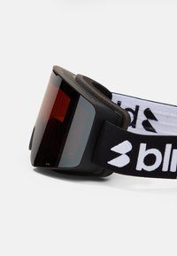 Schwarze Skibrille mit dunklem Verlaufsglas, weicher Polsterung um den Rahmen und einem schwarzen Band mit einem weißen Logo.