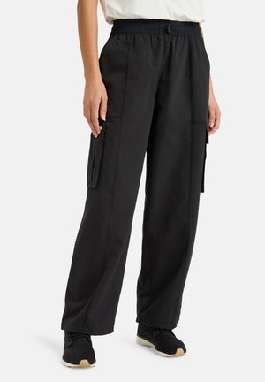 Black cargo pants with an elastic waistband, side pockets, and a loose fit. Made of lightweight fabric with minimal stitching details.