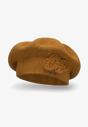 Beret marrón de punto con un acabado texturizado, que presenta un diseño de bordado floral y un pequeño acento de etiqueta. Forma suave y redondeada.