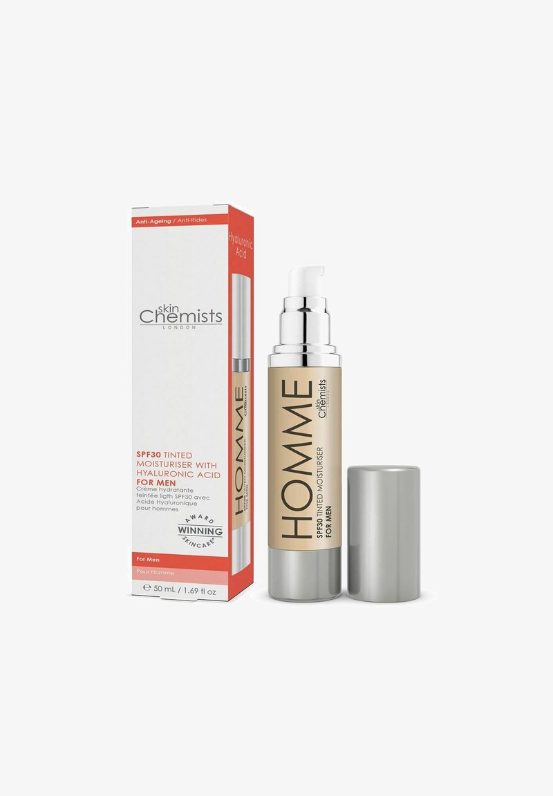 SPF30 tinted moisturizer for men in a silver pump bottle with a beige label. Box displays red accents and product details. 50 mL.